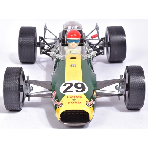 12 - Tinplate Toys - a vintage Japanese made tinplate battery operated model of a Lotus 49 Ford F-1 racin... 