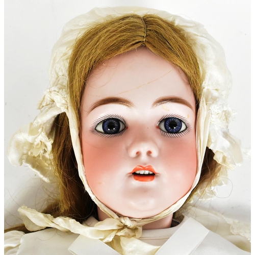 13 - An antique late 19th / early 20th century Simon & Halbig bisque headed doll. The rear of the head st... 