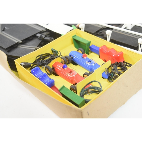 131 - Scalextric - a vintage Triang Scalextric set No. 35 along with a boxed Rostrum Starter. The set cont... 