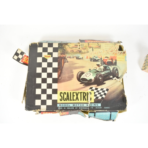 131 - Scalextric - a vintage Triang Scalextric set No. 35 along with a boxed Rostrum Starter. The set cont... 