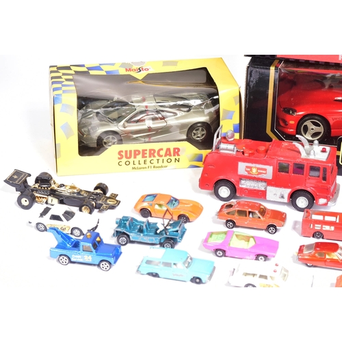 142 - Diecast - a collection of assorted boxed and loose diecast model cars of various scales and makers t... 