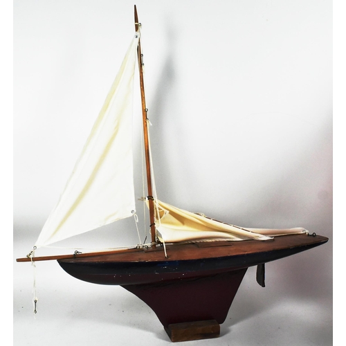 162 - Two vintage hand made scratch built wooden pond yachts. Varnished decks with rigged sails, one with ... 