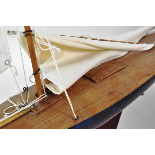 162 - Two vintage hand made scratch built wooden pond yachts. Varnished decks with rigged sails, one with ... 