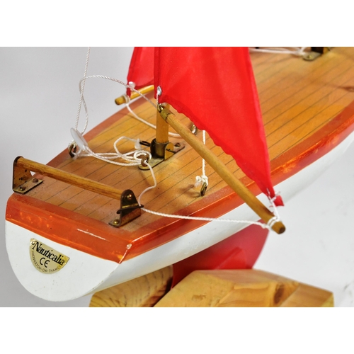 162 - Two vintage hand made scratch built wooden pond yachts. Varnished decks with rigged sails, one with ... 