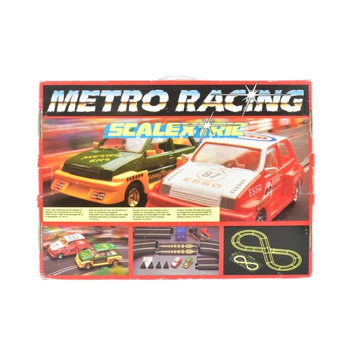 172 - Scalextric - a vintage Hornby Micro Racing Scalextric slot car racing set. The set containing x2 ral... 