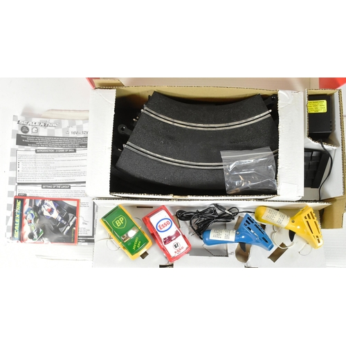 172 - Scalextric - a vintage Hornby Micro Racing Scalextric slot car racing set. The set containing x2 ral... 