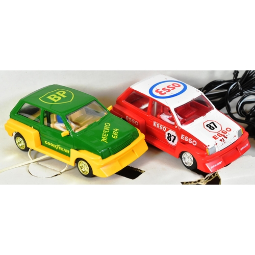 172 - Scalextric - a vintage Hornby Micro Racing Scalextric slot car racing set. The set containing x2 ral... 