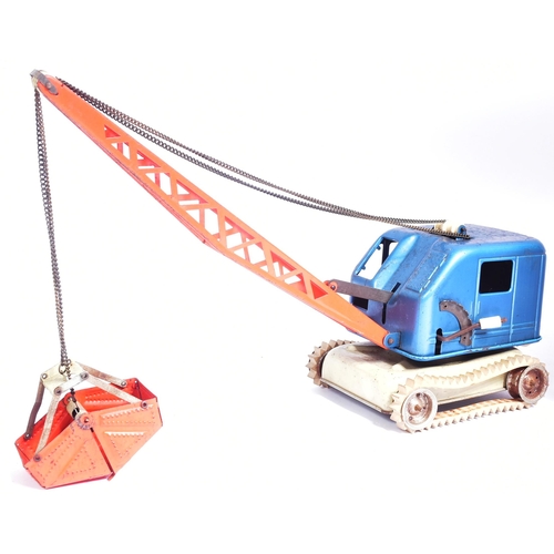 206 - Tinplate Toys - x2 vintage tinplate toys comprising a West German mechanical crane and a boxed Trian... 