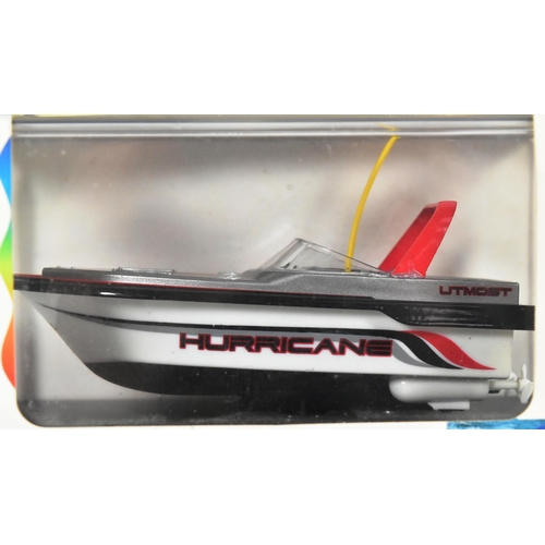 215 - Miniature RC - two miniature Radio Controlled models, the first being a ' Mini Boat ' by Utmost Spur... 