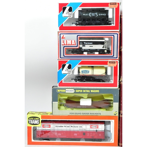 244 - Model Railway - a collection of boxed OO gauge model railway rolling stock, coaches and carriages co... 