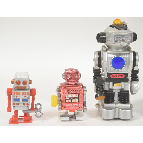 32 - Robots - a collection of assorts tinplate and plastic battery operated mechanical walking robots. Th... 