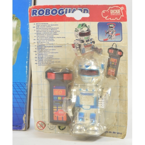 32 - Robots - a collection of assorts tinplate and plastic battery operated mechanical walking robots. Th... 