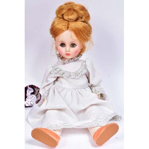 392 - Two vintage Madame Alexander dolls comprising ' Winnie ' a walking doll circa 1950s and a x1 smaller... 