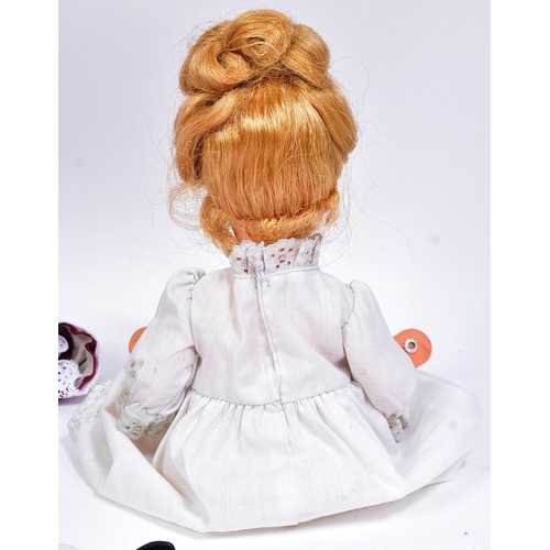 392 - Two vintage Madame Alexander dolls comprising ' Winnie ' a walking doll circa 1950s and a x1 smaller... 