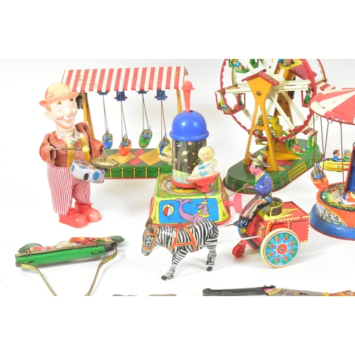 41 - Tinplate Toys - a collection of vintage West German (and other) tinplate clockwork / mechanical toys... 