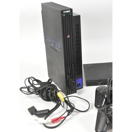 421 - Retro Gaming - an original Sony Playstation PS2 gaming bundle comprising console, PS2 slimline, cont... 