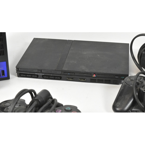 421 - Retro Gaming - an original Sony Playstation PS2 gaming bundle comprising console, PS2 slimline, cont... 