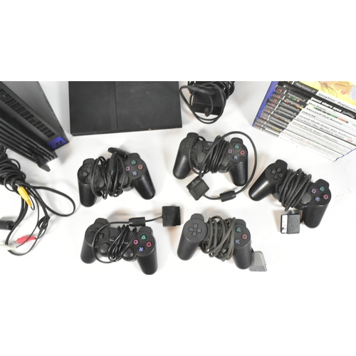 421 - Retro Gaming - an original Sony Playstation PS2 gaming bundle comprising console, PS2 slimline, cont... 