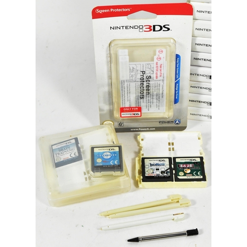 554 - Retro Gaming - an original Nintendo DS Lite hand held video game console and a collection of games. ... 