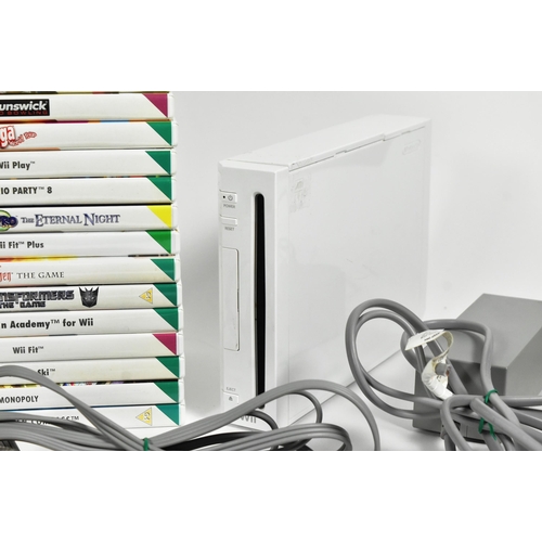 561 - Retro Gaming - an original Nintendo Wii video game console (RVL-001) along with assorted sports game... 