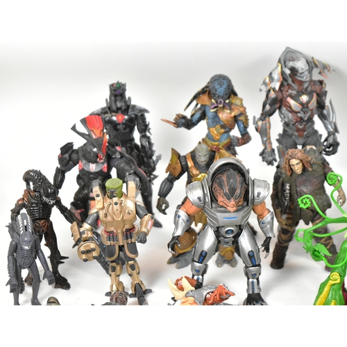 570 - Action Figures - a collection of assorted sci-fi and gaming action figures to include: NECA Predator... 