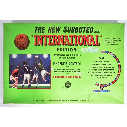 603 - An original vintage Subbuteo International Edition tabletop football game set. The set containing pi... 