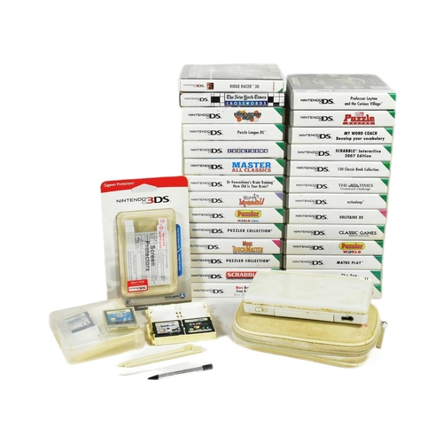 554 - Retro Gaming - an original Nintendo DS Lite hand held video game console and a collection of games. ... 