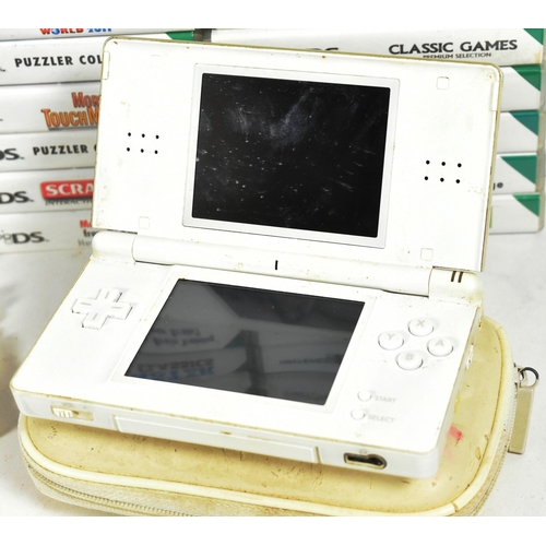 554 - Retro Gaming - an original Nintendo DS Lite hand held video game console and a collection of games. ... 