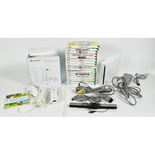 561 - Retro Gaming - an original Nintendo Wii video game console (RVL-001) along with assorted sports game... 