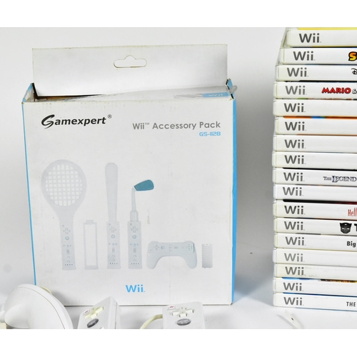 561 - Retro Gaming - an original Nintendo Wii video game console (RVL-001) along with assorted sports game... 