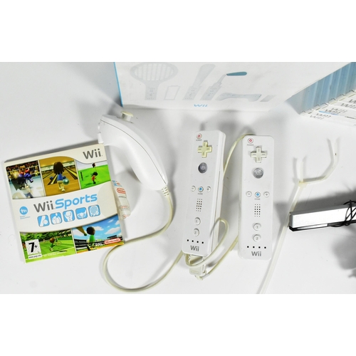 561 - Retro Gaming - an original Nintendo Wii video game console (RVL-001) along with assorted sports game... 