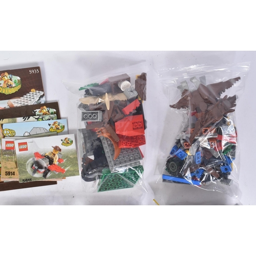 587 - Lego - a collection of Lego Adventure theme sets comprising; 5987 Dino Research Compound, 5911 Johnn... 