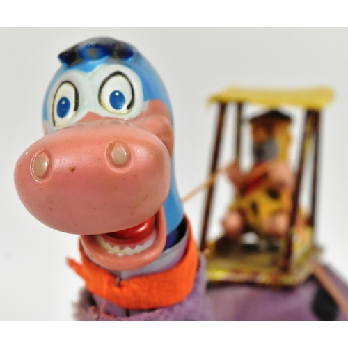 751 - The Flintstones - a vintage 1960s Louis Marx battery operated ' Fred on Dino ' mechanical toy. Tinpl... 