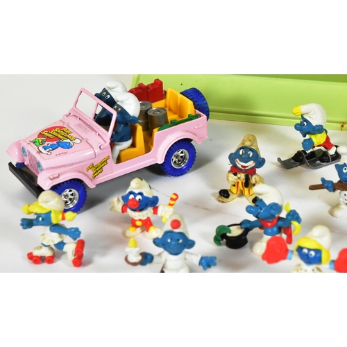 775 - Smurfs - a collection of vintage Peyo / Schliech made Smurf figures, including a Bburago Smurf dieca... 