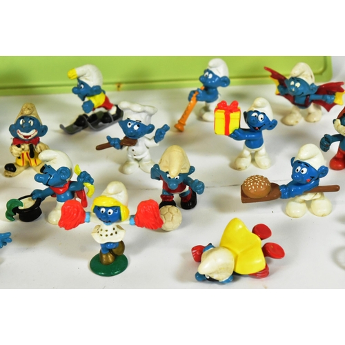 775 - Smurfs - a collection of vintage Peyo / Schliech made Smurf figures, including a Bburago Smurf dieca... 