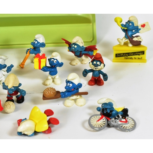 775 - Smurfs - a collection of vintage Peyo / Schliech made Smurf figures, including a Bburago Smurf dieca... 