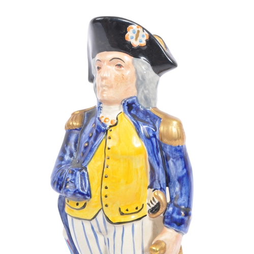 119 - Staffordshire Pottery - An early 20th century 'Horatio Nelson' commemorative character spill vase / ... 