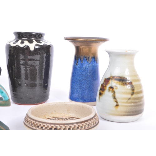 124 - A collection of vintage 20th century studio art pottery vases. Comprising of abstract body painted h... 