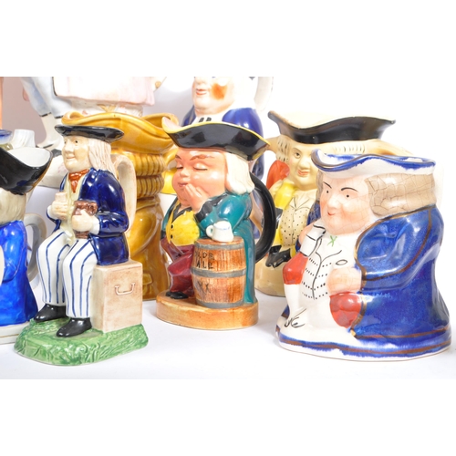 134 - A large collection of thirty 19th & 20th Century porcelain ceramic 'Toby & Character' jugs. A variet... 