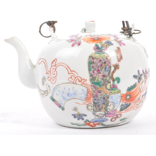 135 - A late 19th century Chinese porcelain teapot. The teapot having white ground with hand painted decor... 