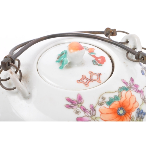 135 - A late 19th century Chinese porcelain teapot. The teapot having white ground with hand painted decor... 