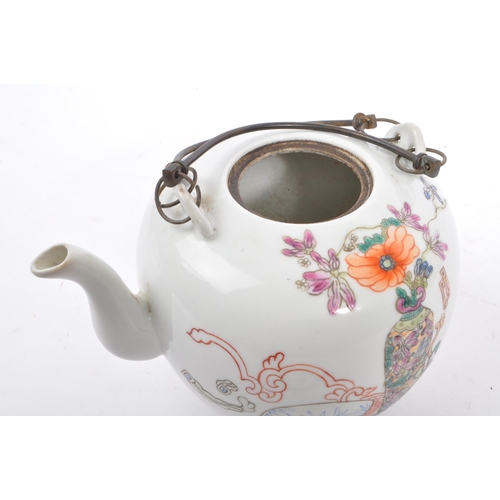 135 - A late 19th century Chinese porcelain teapot. The teapot having white ground with hand painted decor... 