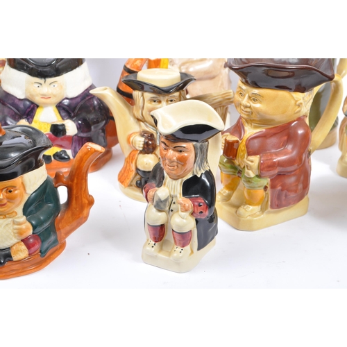 140 - A large collection of twenty one 20th Century porcelain ceramic 'Toby & Character' jugs - mainly by ... 