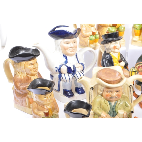 140 - A large collection of twenty one 20th Century porcelain ceramic 'Toby & Character' jugs - mainly by ... 