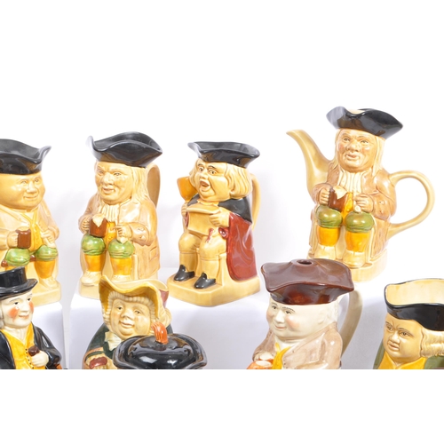 140 - A large collection of twenty one 20th Century porcelain ceramic 'Toby & Character' jugs - mainly by ... 