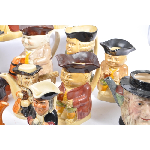 140 - A large collection of twenty one 20th Century porcelain ceramic 'Toby & Character' jugs - mainly by ... 