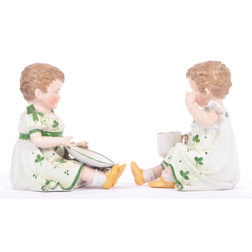 144 - Gebruder Heubach - A pair of matching late antique 19th century hand painted bisque piano child doll... 