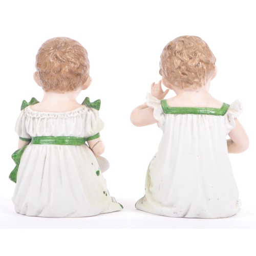 144 - Gebruder Heubach - A pair of matching late antique 19th century hand painted bisque piano child doll... 