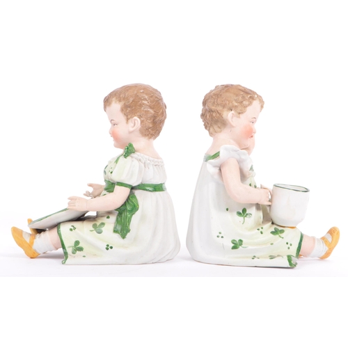 144 - Gebruder Heubach - A pair of matching late antique 19th century hand painted bisque piano child doll... 