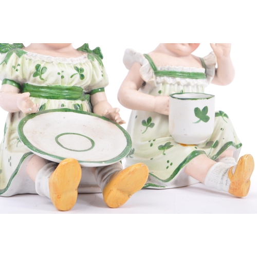 144 - Gebruder Heubach - A pair of matching late antique 19th century hand painted bisque piano child doll... 